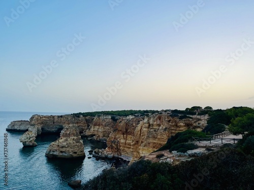 ocean rocky coast, cliff, evening time, idyllic