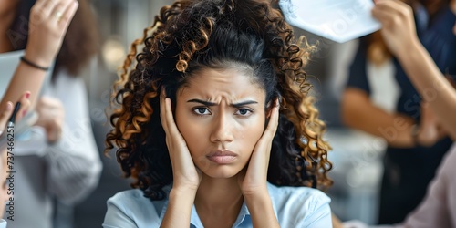 Emotionally overwhelmed office worker displays visible distress in workplace setting. Concept Office Stress, Emotional Breakdown, Workplace Pressure, Overwhelming Emotions, Office Distress photo