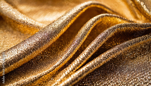Luxurious golden fabric with shimmering sheen, epitomizing opulence and eleganc photo