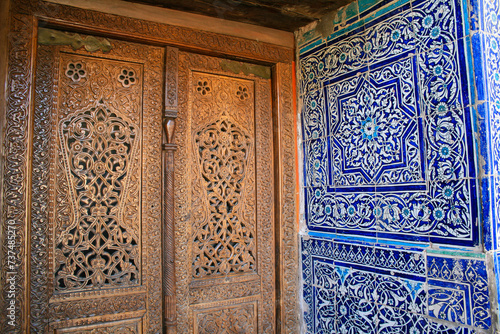Ancient Uzbek wood carving and tiles photo