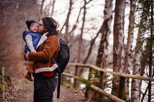 Joyful Father-Son Bonding on a Forest Trail Hike