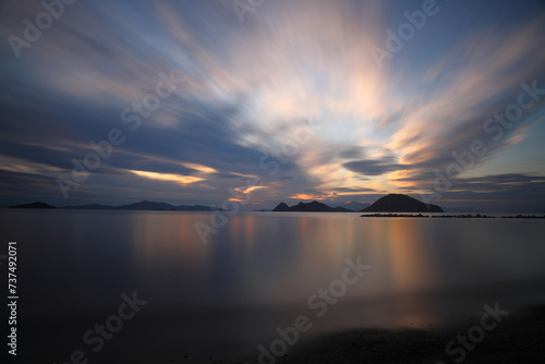 Fototapeta Naklejka Na Ścianę i Meble -  sunset on the beach. Seaside town of Turgutreis and spectacular sunsets. Selective Focus. Long Exposure shoot. tranquility scene.