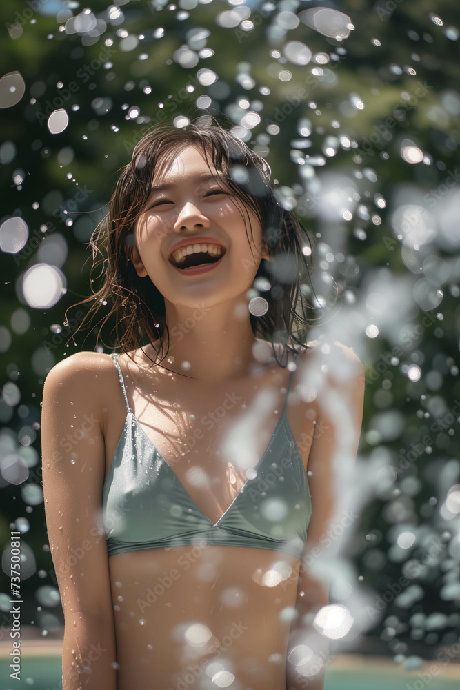 Asian woman in swimsuit bathing outdoors.