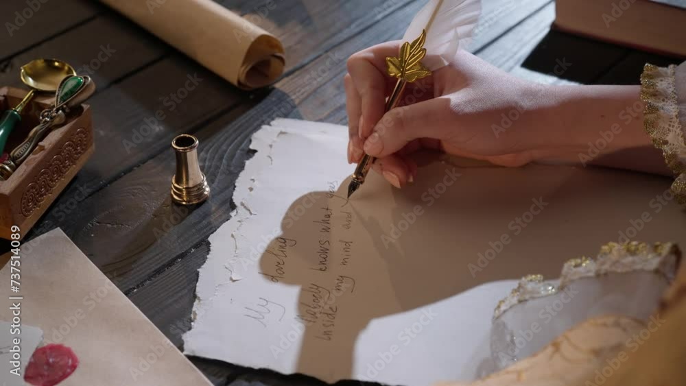 Antique female writing with old feather pen. Woman in renaissance dress writing a love letter with vintage quill pen on old parchment papers sheet.