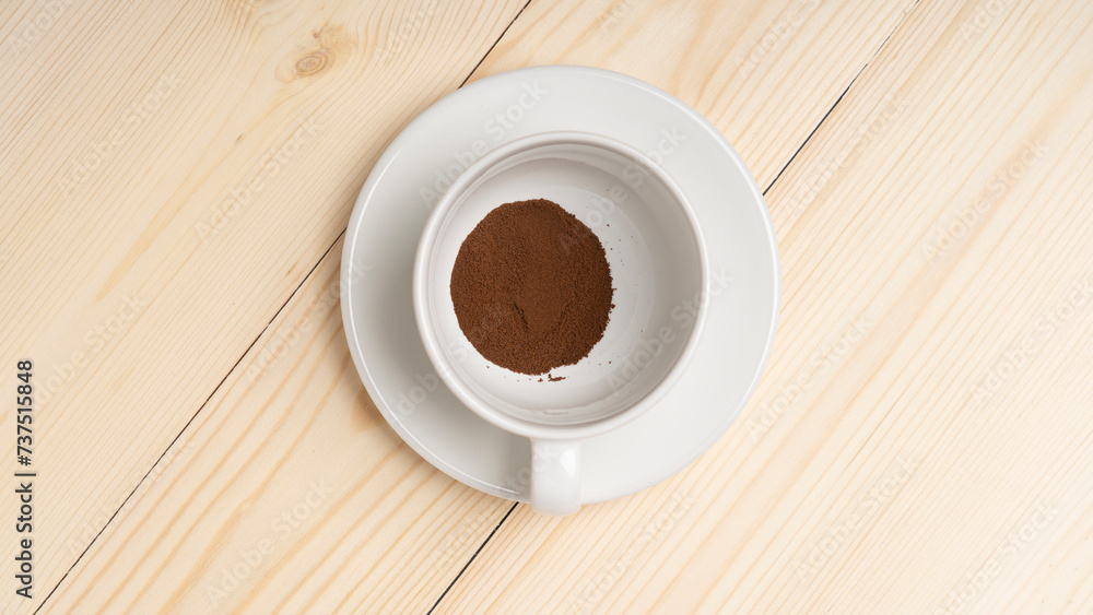 Obraz premium freeze-dried coffee, Instant coffee in white cup on wooden background, the view from top.