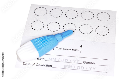 Fotografie New Dried Blood Spot test card with lancet for hormone testing