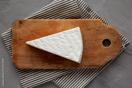 Tableau sur toile Organic Brie Cheese on a wooden board, top view