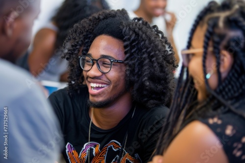 Black college students laughing and conversing in a stock photo photo
