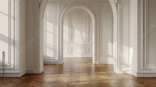 A simple and clean empty room with white walls and wood floors. Suitable for various interior design concepts