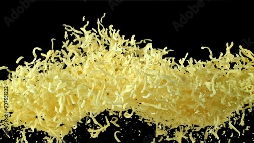 The grated cheese flies up and falls down. Filmed on a high-speed camera at 1000 fps. High quality FullHD footage photo