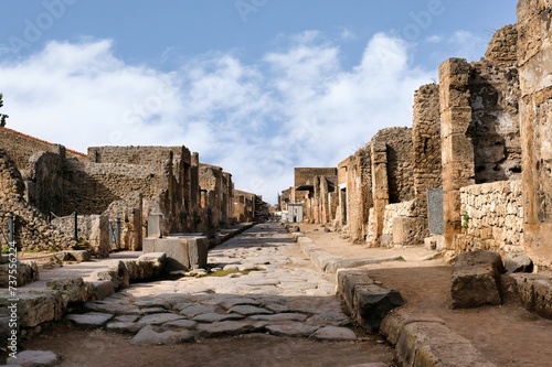 Via dell'Abbondanza was the main street of Pompeii, a bustling thoroughfare lined with shops, restaurants, and public buildings. It was a key part of the city's economy and social life. photo