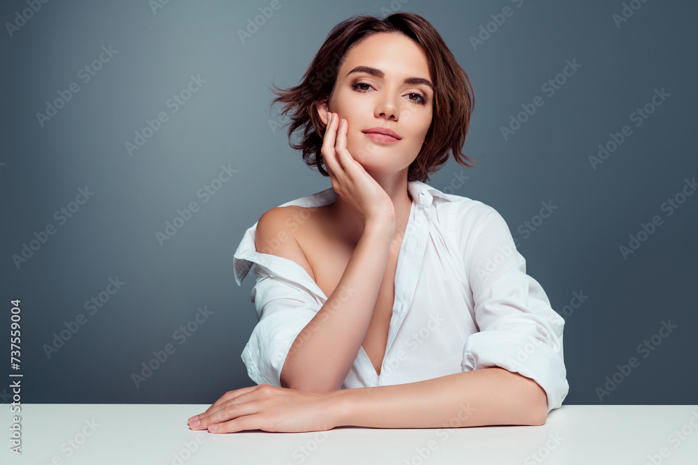 Photo of pretty young girl touch face treatment cosmetology wear white sexy shirt isolated on gray color background Photo of pretty young girl touch face treatment cosmetology wear white sexy shirt isolated on gray color background