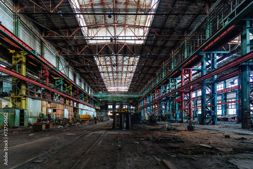 Abandoned factory. Large empty ruined industrial hall photo