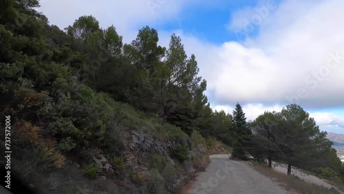 Road from Puerto Saucillo,Sierra de las Nieves national park, Andalusia, Spain. Time lapse series. photo