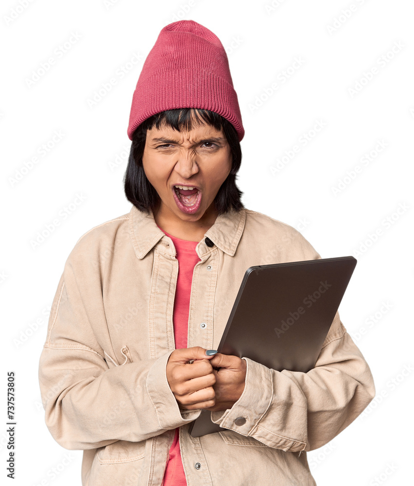 Young Hispanic student with laptop in studio being shocked, she has remembered important meeting. Young Hispanic student with laptop in studio being shocked, she has remembered important meeting.