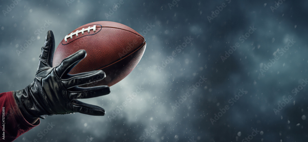 Close-Up of a Hand Catching American Football under Dramatic Rainy Skies. Banner with copy space Close-Up of a Hand Catching American Football under Dramatic Rainy Skies. Banner with copy space