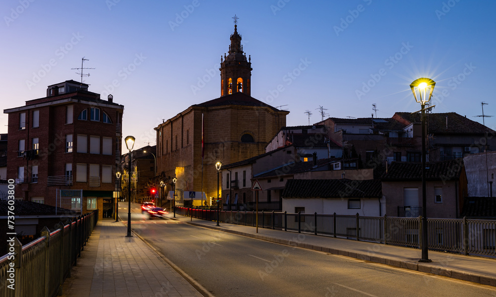 Deserted streets of ancient city Cenicero in province of Rioja, northeastern Spain. Soft evening light of lanterns illuminates narrow stone bridges of town Cenicero
