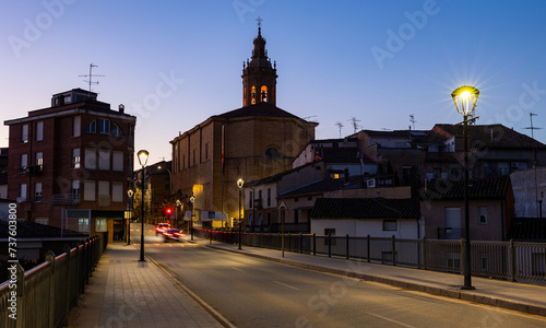 Deserted streets of ancient city Cenicero in province of Rioja, northeastern Spain. Soft evening light of lanterns illuminates narrow stone bridges of town Cenicero