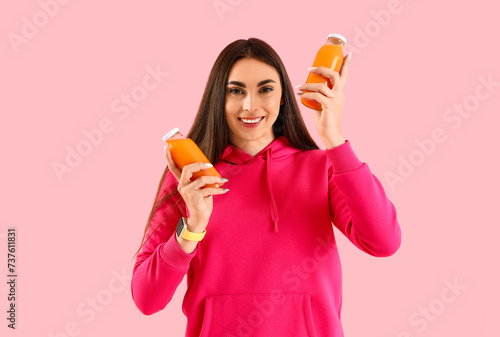 Young woman with bottles of...