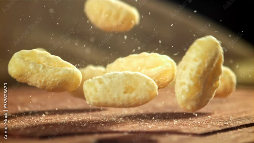 Gnocchi fall onto the cutting board. Filmed on a high-speed camera at 1000 fps. High quality FullHD footage Gnocchi fall onto the cutting board. Filmed on a high-speed camera at 1000 fps. High quality FullHD footage