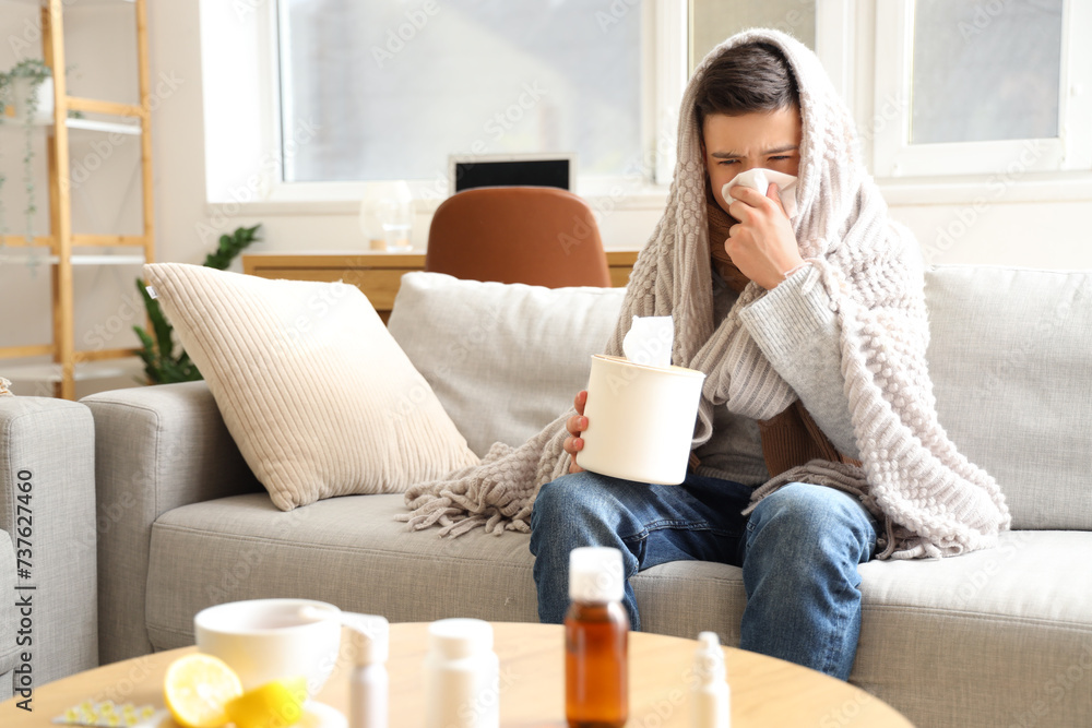 Sick little boy with plaid and tissue sneezing at home Sick little boy with plaid and tissue sneezing at home
