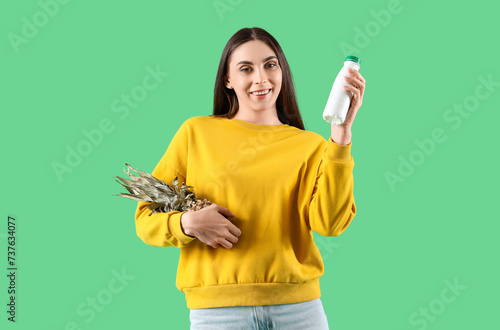 Young woman with bottle of ...