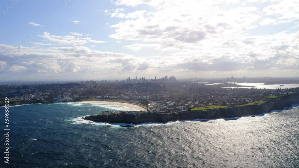 Aerial Panning Beautiful View Of Suburb At Bondi Beach By Wavy Sea On Sunny Day - Sydney, Australia Aerial Panning Beautiful View Of Suburb At Bondi Beach By Wavy Sea On Sunny Day - Sydney, Australia