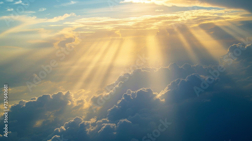 Sun rays shine through the tiny gaps between layers of layered stratocumulus clouds.