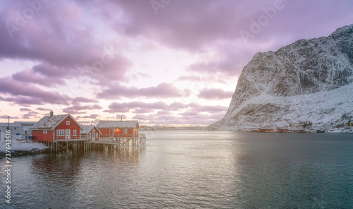 norway lofoten beach red houses clouds in the air sunset light and colors