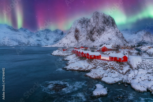 norway lofoten beach and red houses with night northern lights aurora borealis