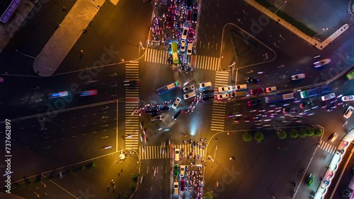 Aerial time-lapse of evening traffic at intersection in Ho Chi Minh City, Vietnam. photo