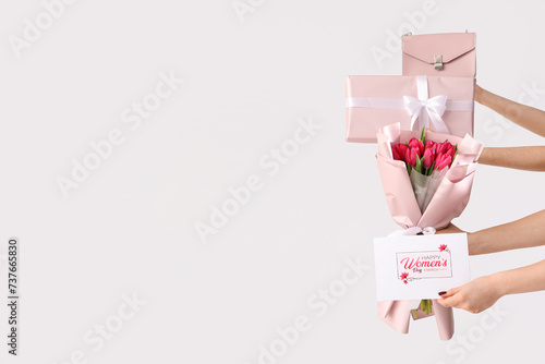 Female hands with bouquet o...