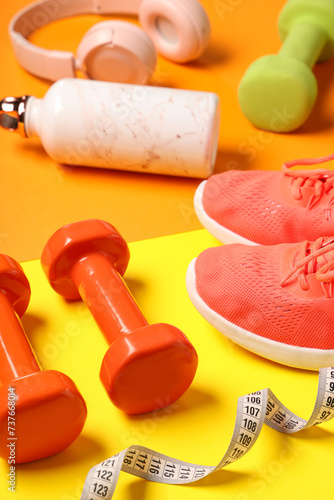 Composition with sports equipment and shoes on color background © Pixel-Shot