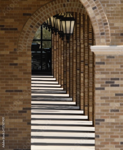 Outdoor breezeway with hanging lamps photo