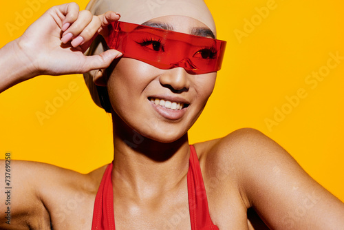 Woman sunglasses beauty asian emotion smiling yellow fashion portrait goggles red