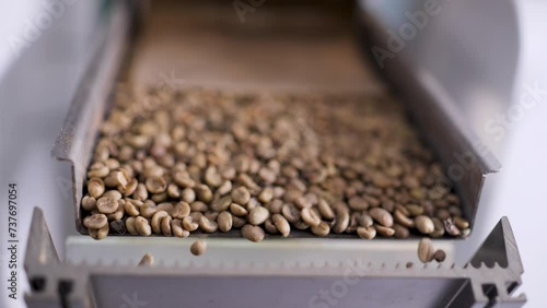 The machine separates out spoiled coffee beans using sensors. photo