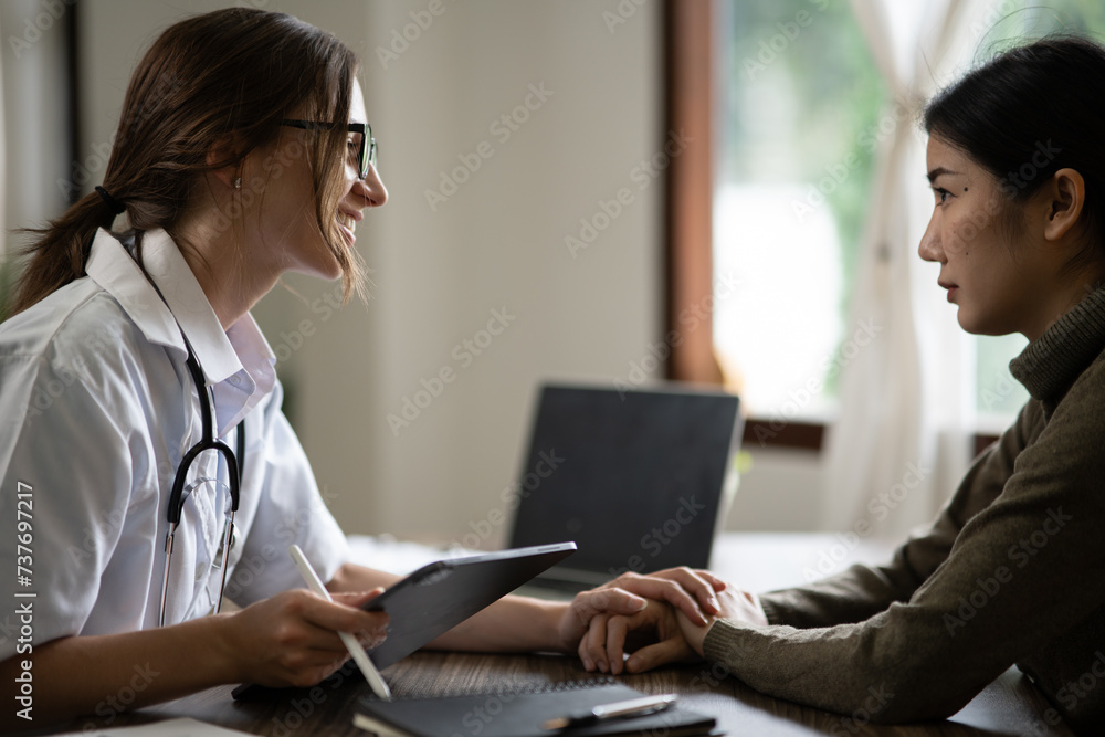 Female doctor examining a patient and encouraging the patient. At the clinic. In the hospital. Female doctor examining a patient and encouraging the patient. At the clinic. In the hospital.
