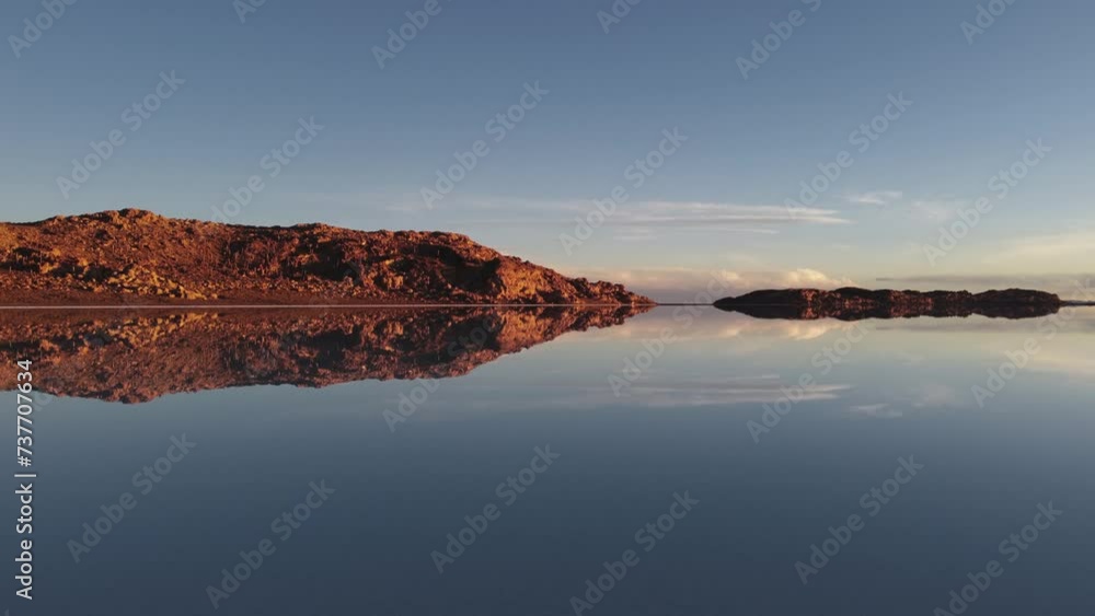 Sky perfectly reflected in lake water, Bolivia altiplano golden rock Sky perfectly reflected in lake water, Bolivia altiplano golden rock