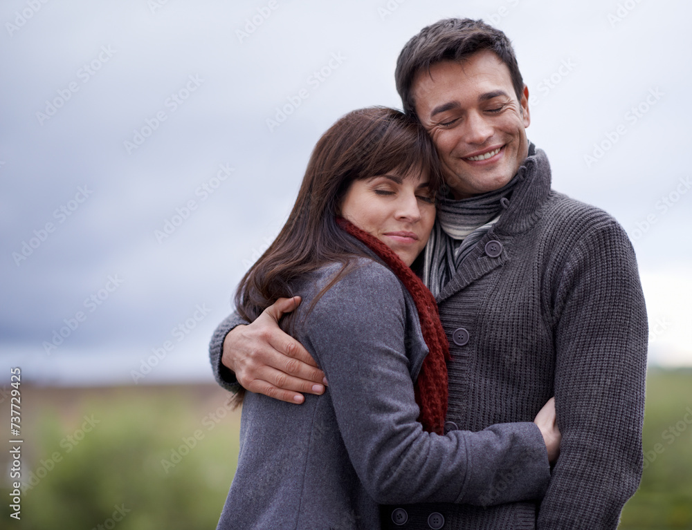 Love, smile and hug with couple in countryside together for weekend bonding or romantic date. Environment, nature or park with man and woman embracing outdoor for safety, security or trust in morning Love, smile and hug with couple in countryside together for weekend bonding or romantic date. Environment, nature or park with man and woman embracing outdoor for safety, security or trust in morning