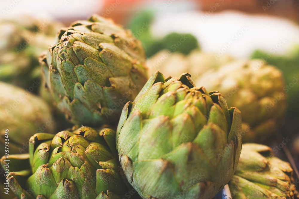Fototapeta premium Artichokes on shelf in grocery store