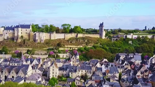 Aerial clip of the historic riverside village overshadowed by large Chateau Chinon photo