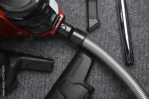 Vacuum cleaner with attachments on carpet photo