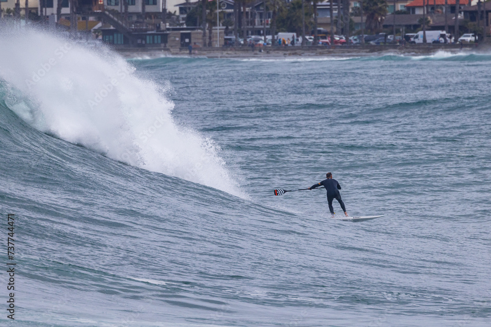 Huge waves and paddle boarding