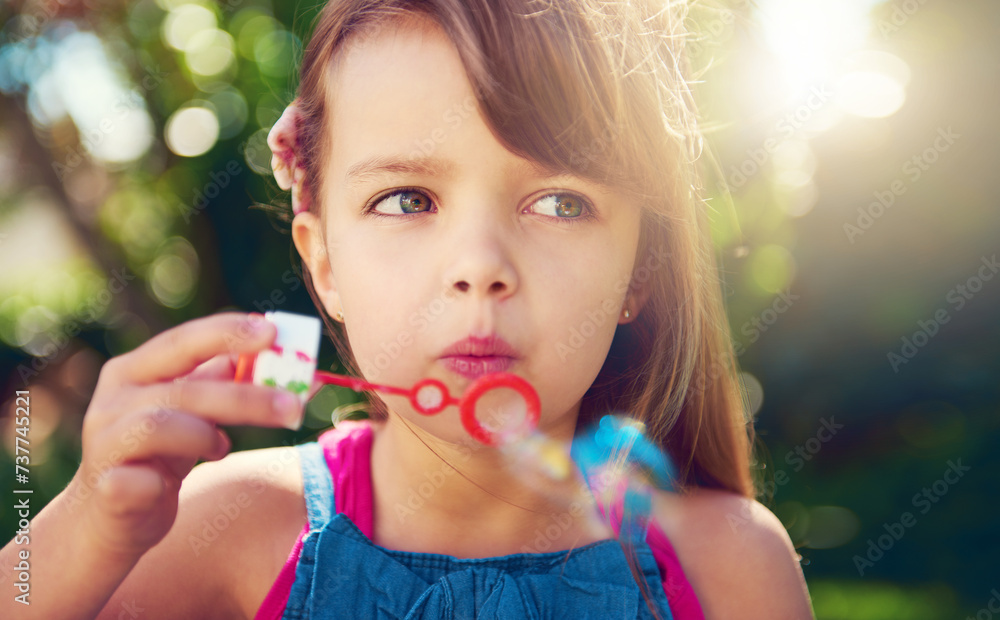Park, girl and child blowing bubbles in nature, relax and having fun outdoor. Toy, garden and face of kid with soap on summer vacation for recreation, leisure and playing game closeup for freedom Park, girl and child blowing bubbles in nature, relax and having fun outdoor. Toy, garden and face of kid with soap on summer vacation for recreation, leisure and playing game closeup for freedom