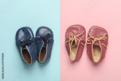Children's leather shoes on a blue-pink background