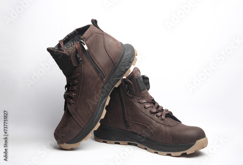 Brown leather boots on white background