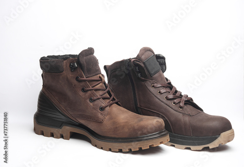 Different Brown leather boots on white background