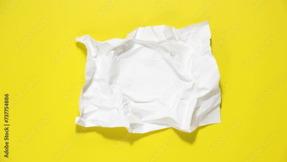 Stop motion animation of crumpled paper, stop motion animation 4k, on a yellow background. Stop motion animation of crumpled paper, stop motion animation 4k, on a yellow background.