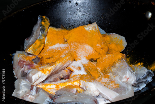 Fresh fish meat slices for preperation, fish cooking turmeric powder and salt (ID: 737791888)