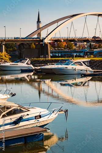 Summer view with reflections and pleasure boats at Vilshofen, Danube, Bavaria, Germany photo